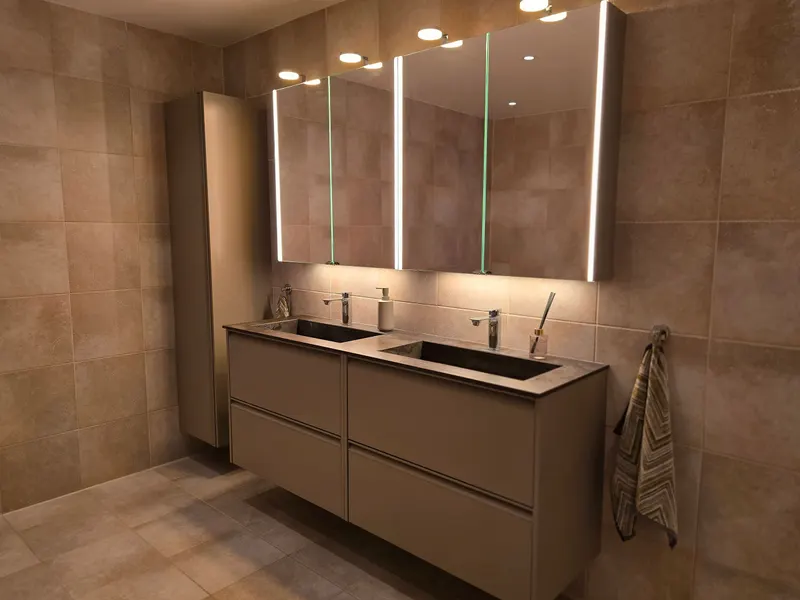 Lit mirror cabinets in the renovated bathroom