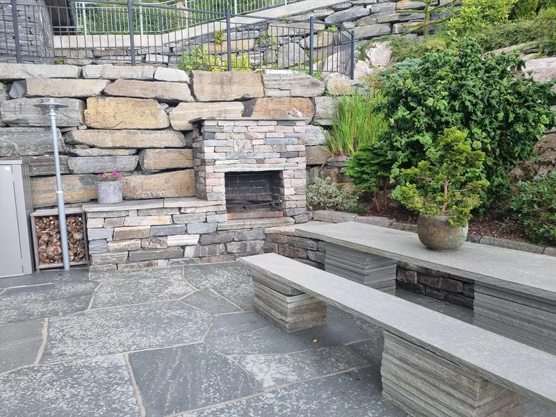 Hand-built stone fireplace and table for ten